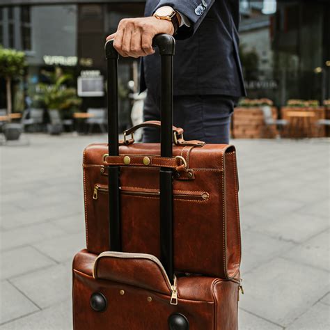 leather luggage bag with wheels.